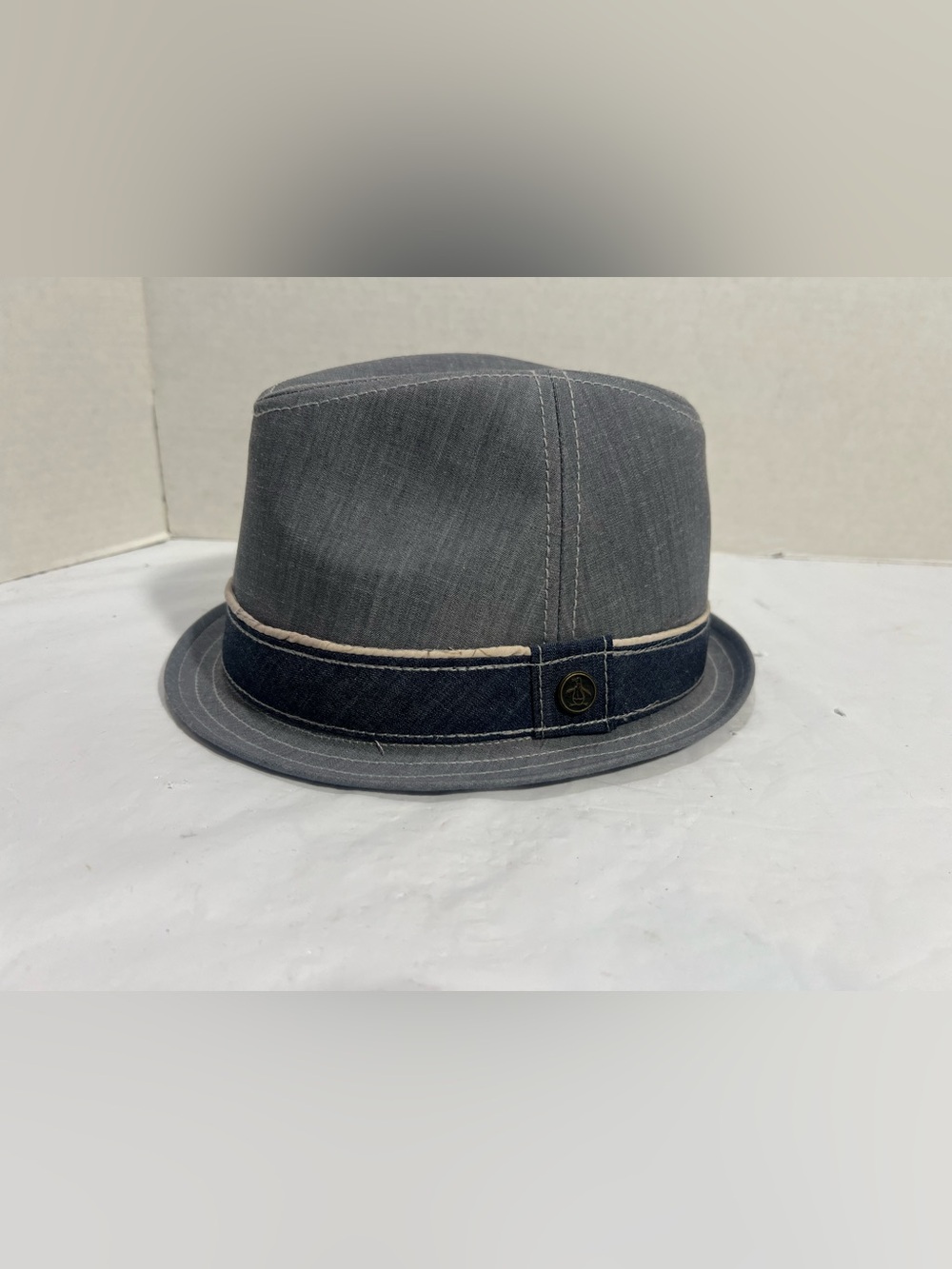 Stylish Original Penguin Men's Fedora gray hat with a dark band.